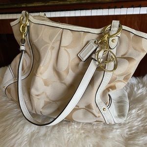 A lovely Coach year round bag can be used with winter whites